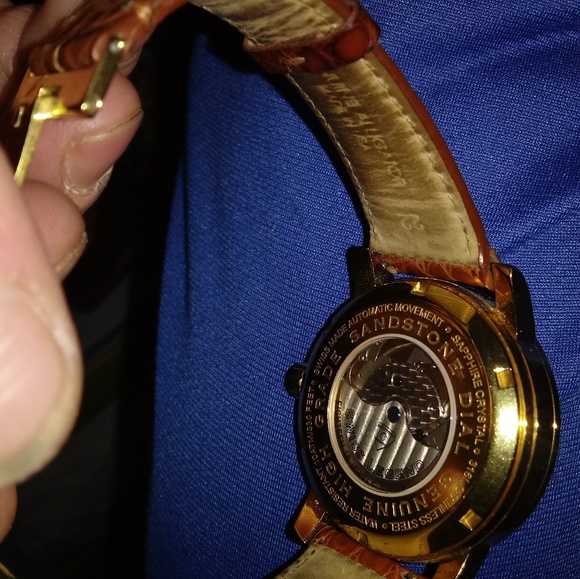 Micheal khors book bag and a swiss legend watch